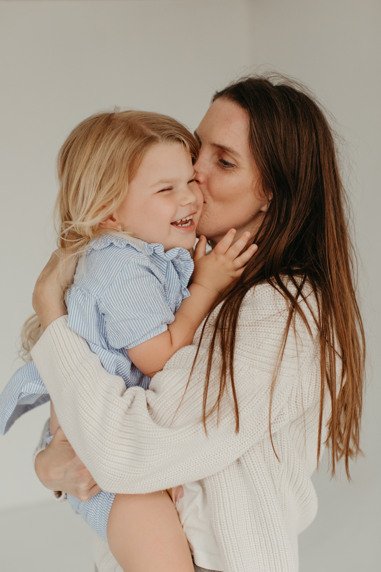 mom and daughter laughing